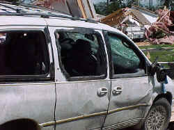 Close-up of blown out windows in van.