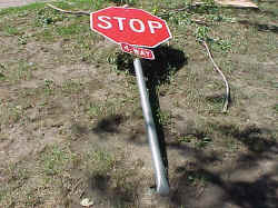 Stop sign bent flat to ground.