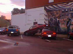 Car lifted by tornado onto another car in Lennox, SD.