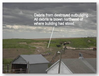 Photo of debris blown to the northeast of destroyed outbuilding.