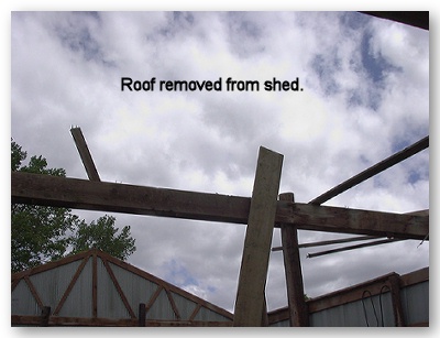 Photo of shed with roof removed by strong winds.