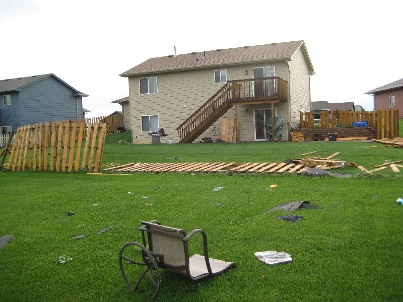 Fence knocked down by wind.