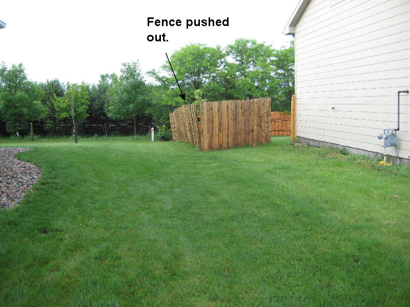 Fence leaning to the east from 60 mph west winds.