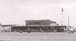 The Huntsville Airport bhad a new terminal building in the mid-1950s.  This image faintly shows the wind vane and anemometer on top of the building.