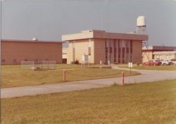 The National weather Service building at the Huntsville International Airport in the mid 1970s.  The WSR-3 radar can be seen next to the building, with rain gauges and an instrument shelter in front.